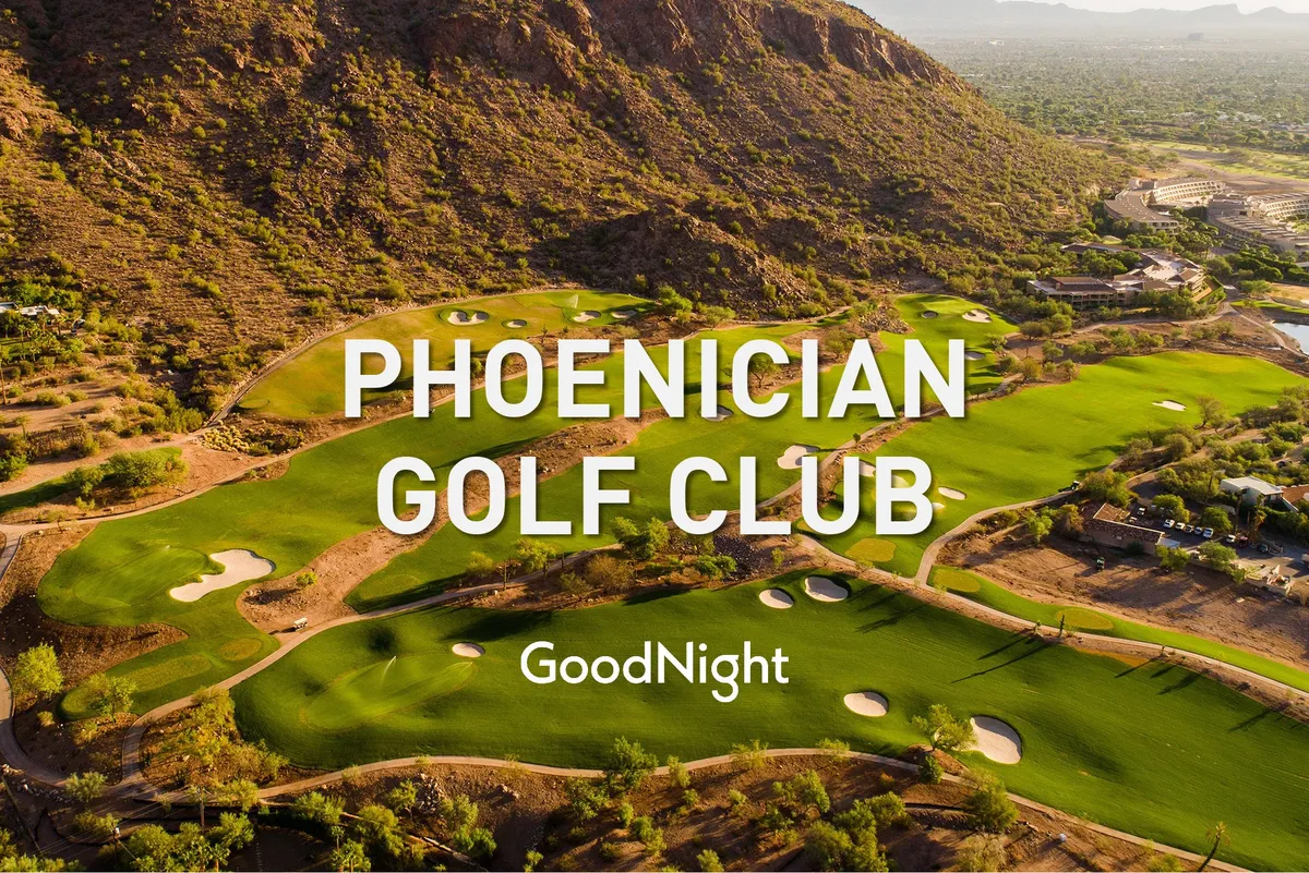A lush golf course stretches out with perfectly manicured greens and sand traps, set against a stunning mountain backdrop. The modern clubhouse is visible, and palm trees dot the landscape, creating a tranquil setting ideal for golfing and relaxing in nature.